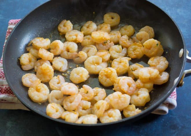 shrimp being cooked in a pan