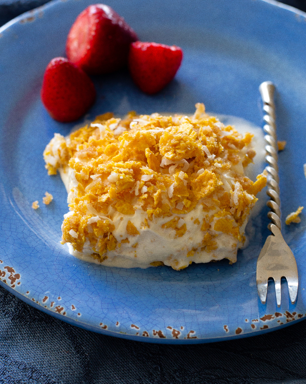 This Crunchy Ice Cream Dessert layers has of coconut, crushed cornflakes, brown sugar, and melted butter. #crispy #ice #cream #dessert