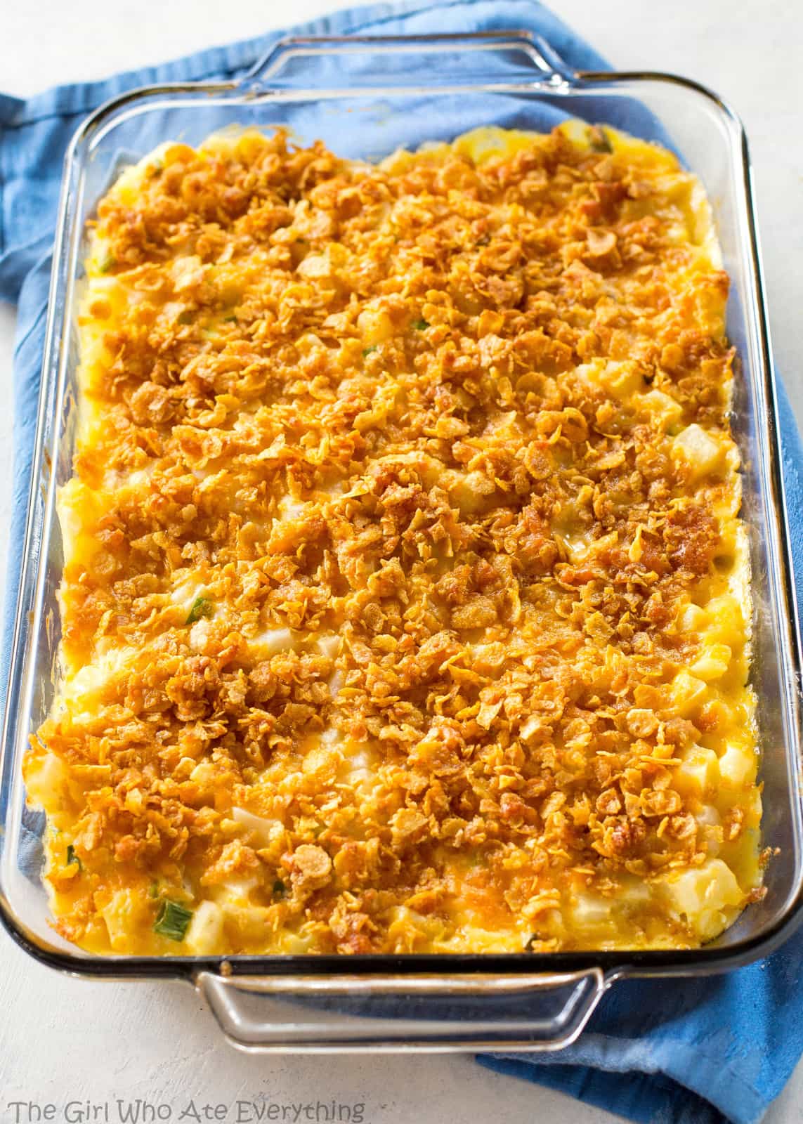 Funeral Potatoes - creamy, cheesy potatoes topped with buttery crunchy cornflakes. These are always a hit at get togethers. #funeral #potatoes #sides #dish #recipe #potluck