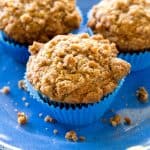 Banana Crumb Muffins - Moist banana muffins with a little cinnamon and nutmeg and topped with tons and tons of crumb topping. the-girl-who-ate-everything.com