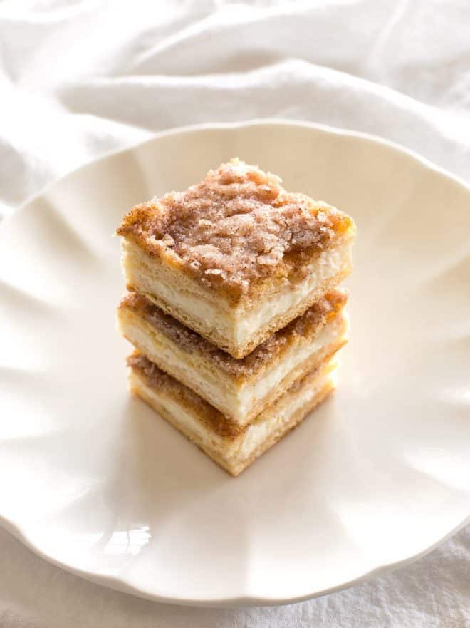 slices of sopapilla cheesecake on a white plate