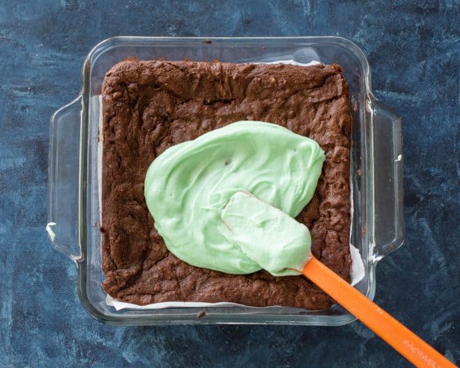 brownies in a pan with green frosting