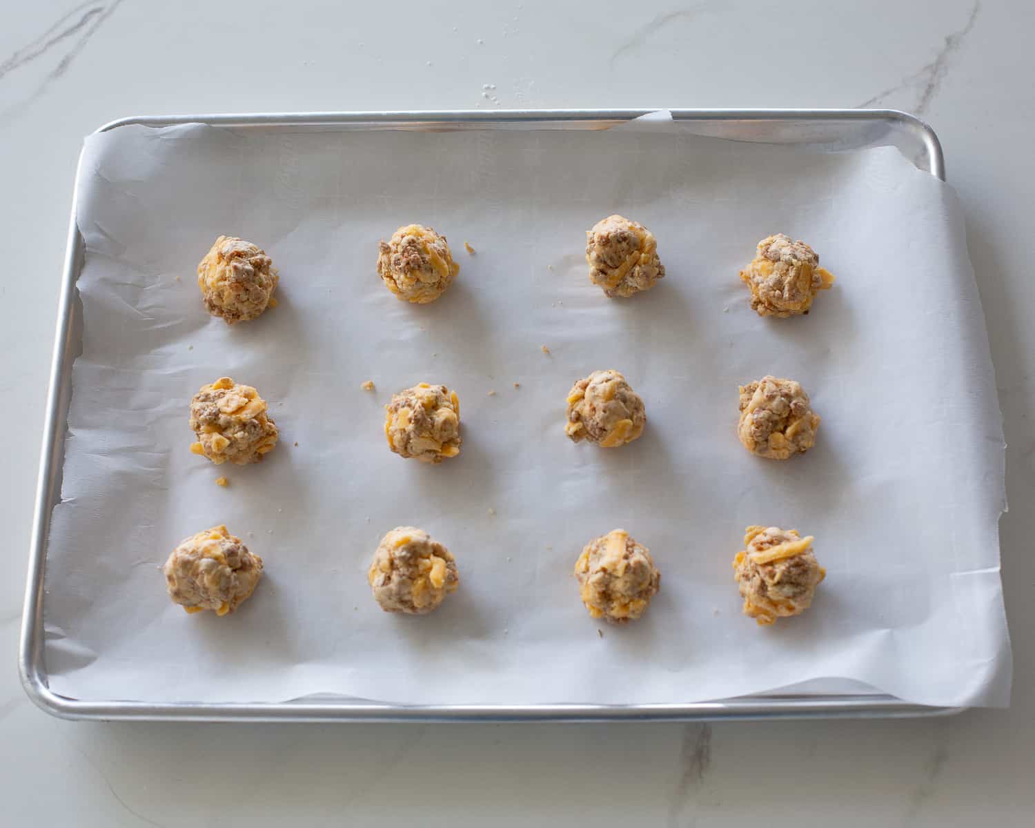 cheese balls on baking sheet