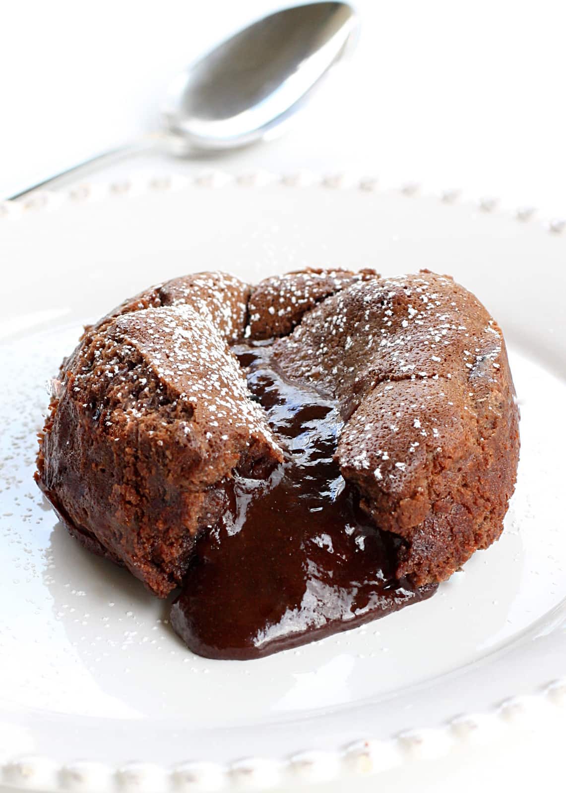 Roy's Chocolate Souffle (Molten Lava Cakes) - a gooey chocolate center is a surprise in the middle! A chocolate lover's dream. Not a copycat recipe. The actual recipe from Roy's. the-girl-who-ate-everything.com