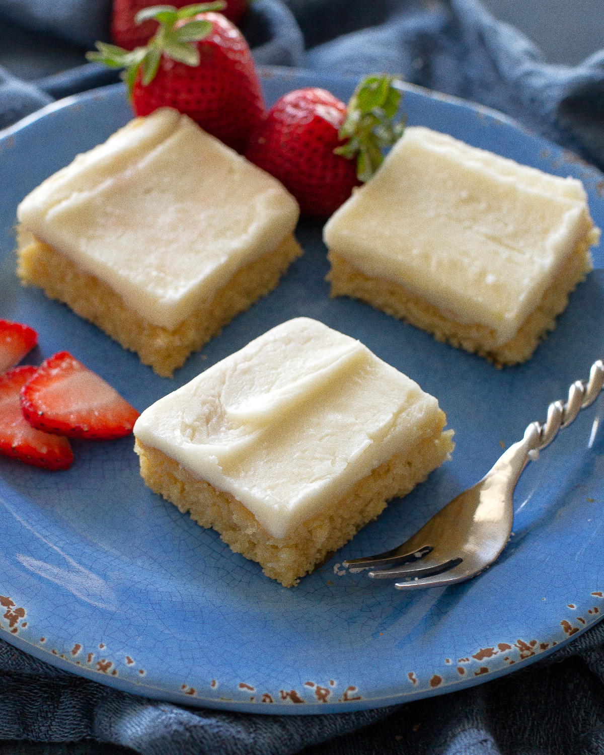 White Texas Sheet Cake is a great cake for feeding a crowd. Buttery, moist, and covered in an almond flavored frosting, this cake is a tried and true recipe. #white #texas #sheet #cake #recipe
