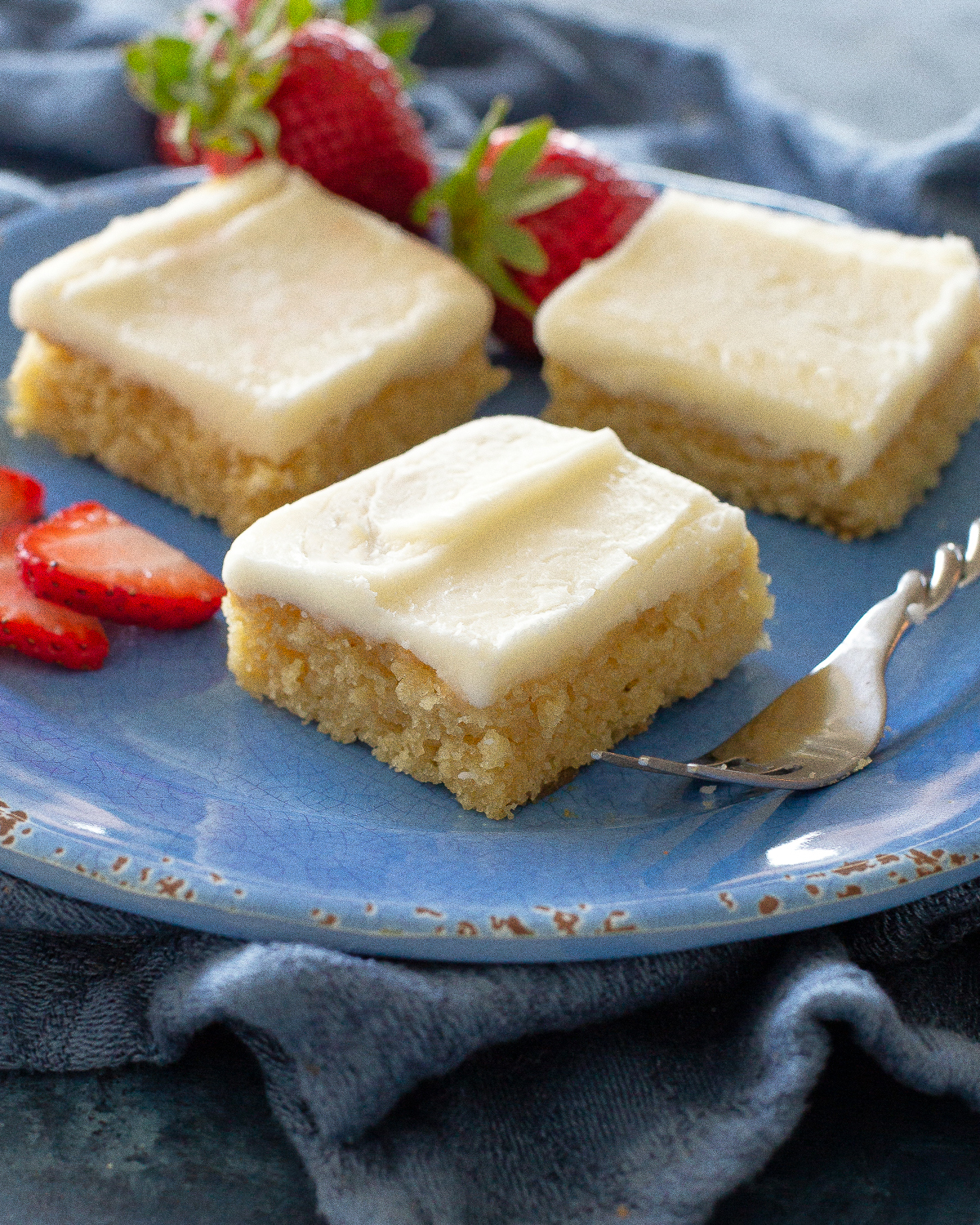 White Texas Sheet Cake is a great cake for feeding a crowd. Buttery, moist, and covered in an almond flavored frosting, this cake is a tried and true recipe. #white #texas #sheet #cake #recipe