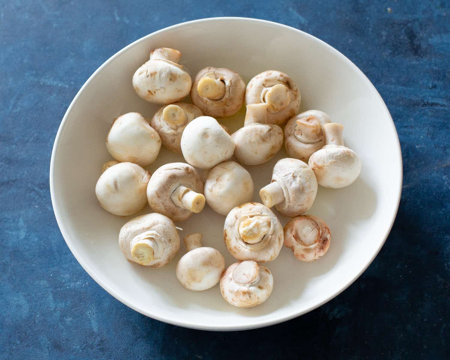 mushrooms in a white bowl