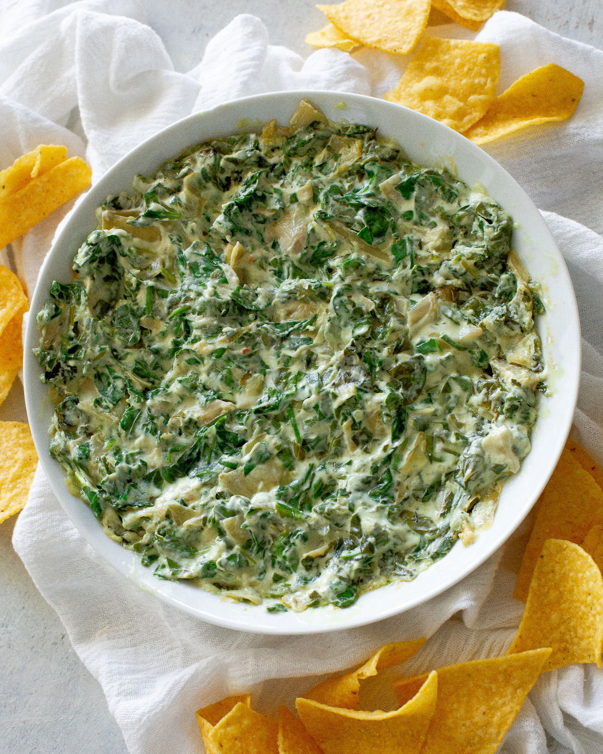 This Creamy Spinach and Artichoke Dip is made from spinach, cream cheese, sour cream, and mayonnaise make this dip so good! #artichoke #dip #recipe #spinach