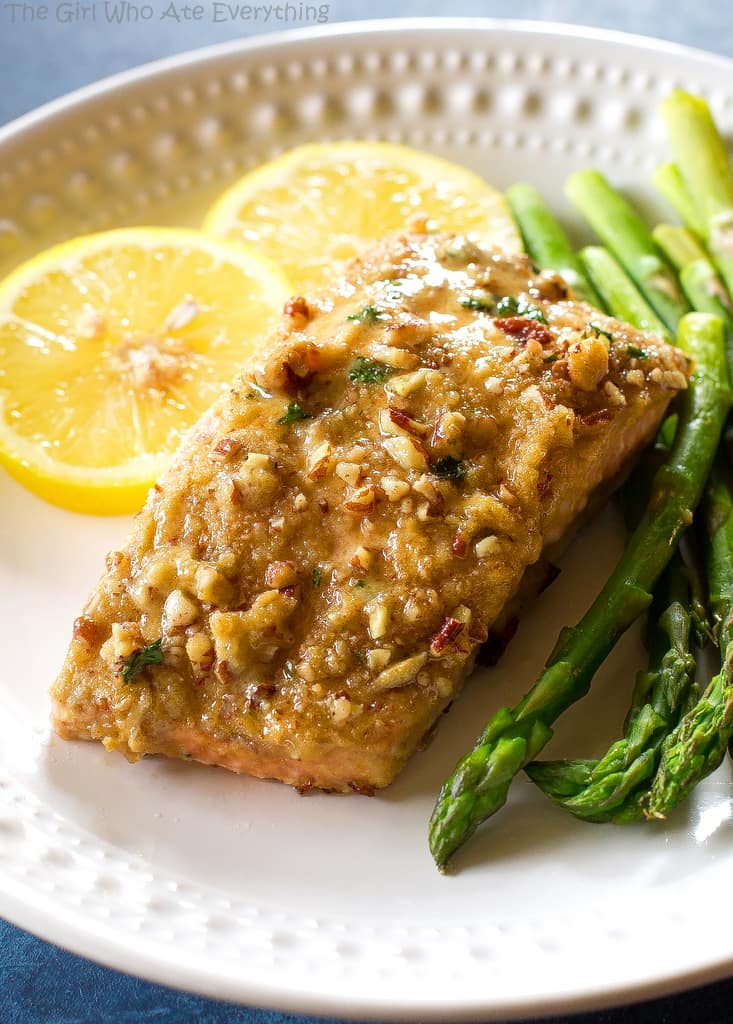 Baked Dijon Salmon - salmon topped with honey, dijon mustard, pecans, and breadcrumbs. An easy weeknight dinner. the-girl-who-ate-everything.com