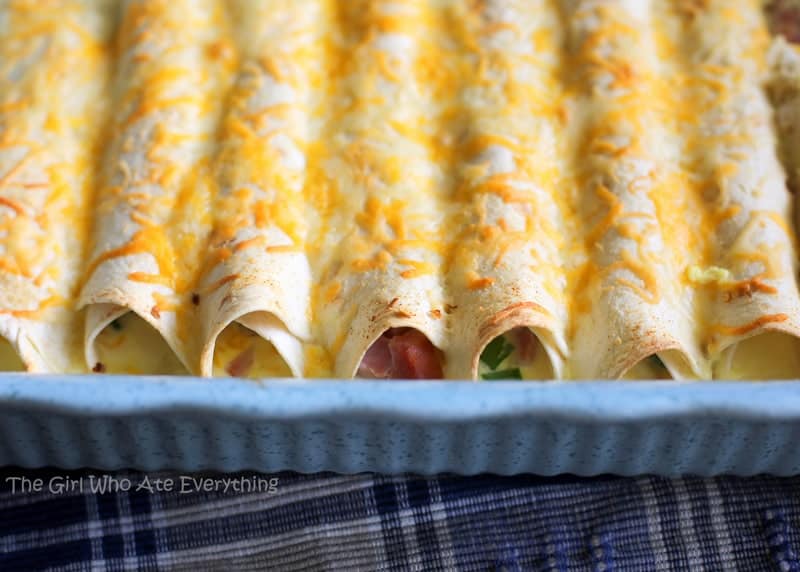 (Overnight) Ham and Cheese Breakfast Enchiladas - a great way to use up leftover ham. Great for breakfast, brunch, or dinner. the-girl-who-ate-everything.com