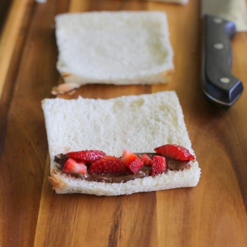 French Toast Roll-Ups - cream cheese, fruit, or whatever fillings you like rolled up in cinnamon sugar bread. the-girl-who-ate-everything.com