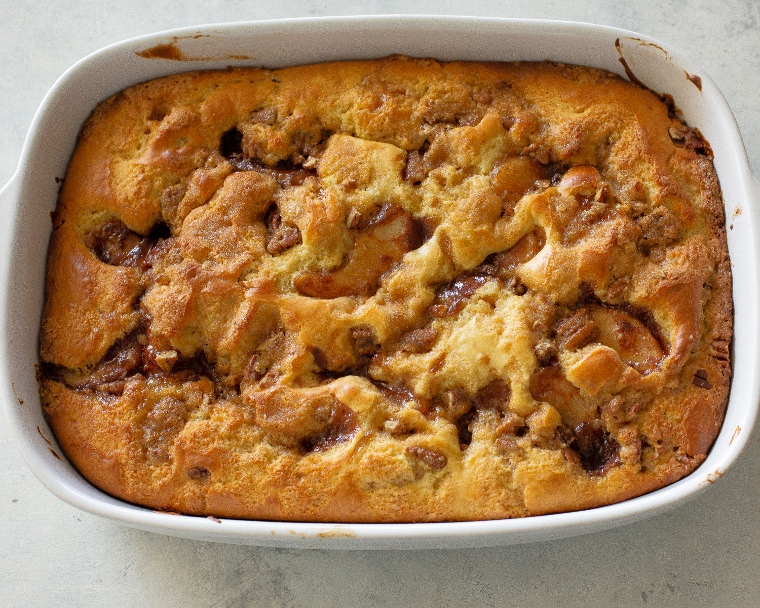 This Apple Streusel Coffee Cake recipe is full of cinnamon apple flavor and big enough to feed a crowd.  No cake mix here. This one starts from scratch! #apple #coffee #cake