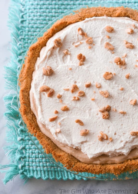This Peanut Butter Pie recipe has a rich peanut butter flavor with honey roasted nuts and a graham cracker crust. the-girl-who-ate-everything.com