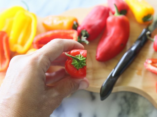 Mini Taco Stuffed Peppers - mini bell peppers stuffed with taco meat and drizzled with a cilantro cream sauce. {The Girl Who Ate Everything}