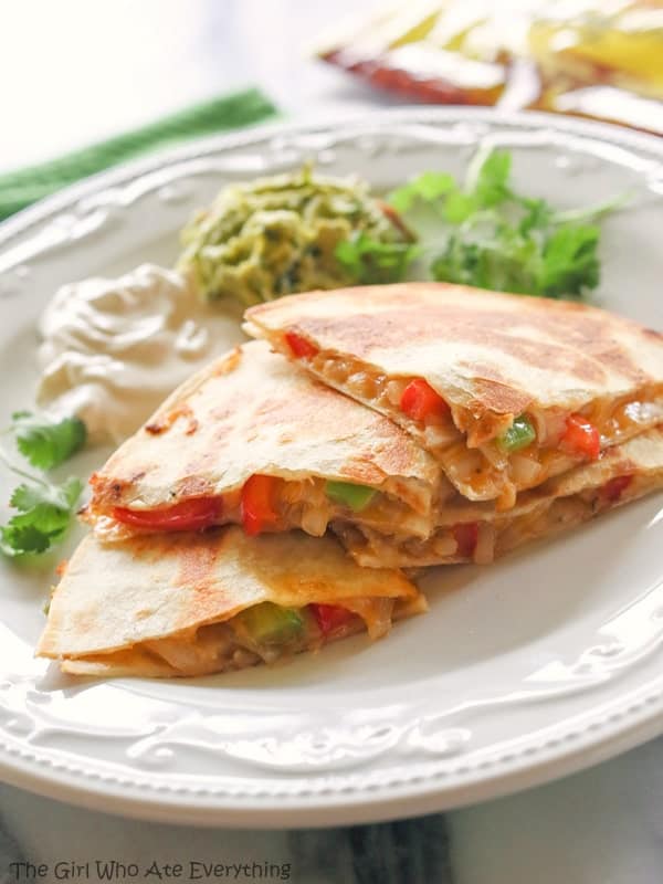 Fajita Quesadillas - Tortillas are filled with seasoned veggies and lots of cheese. A quick dinner for any night of the week. {The Girl Who Ate Everything}