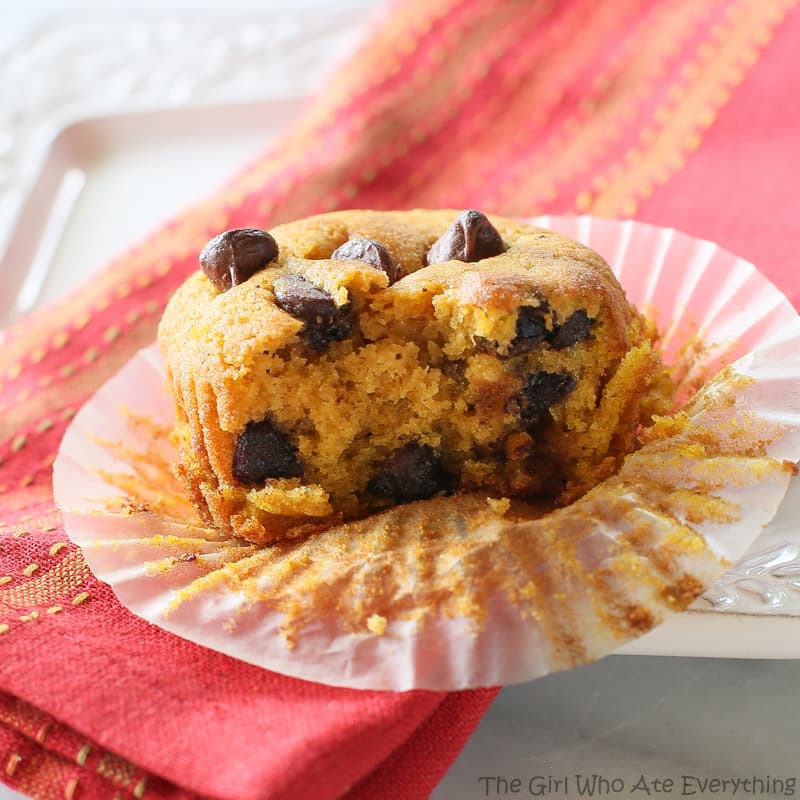 These Pumpkin Chocolate Chip Muffins are moist pumpkin spiced treats dotted with chocolate chips. This is the only pumpkin chocolate chip muffin recipe you will ever need. the-girl-who-ate-everything.com