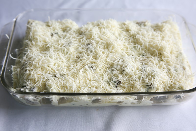Chicken, Spinach, and Mushroom Enchiladas - creamy enchiladas topped with a cilantro sour cream sauce. This dish is company worthy. the-girl-who-ate-everything.com