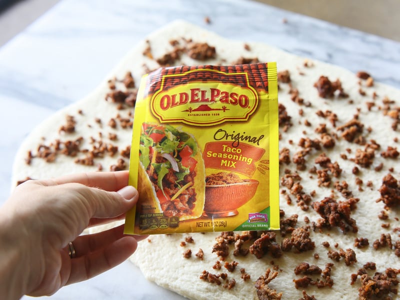 Taco Pizza Rolls - taco meat and cheese rolled up in pizza dough and topped with your favorite taco toppings. the-girl-who-ate-everything.com