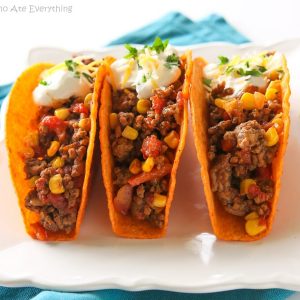 These Texas Tacos are a Tex-Mex twist on your classic taco. It’s filled with taco meat, bell peppers, onions, diced tomatoes, and corn. the-girl-who-ate-everything.com