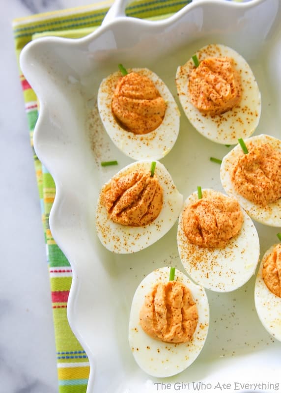Roasted Red Pepper Deviled Eggs - naturally orange colored pumpkin shaped deviled eggs. the-girl-who-ate-everything.com Roasted Red Pepper Deviled Eggs