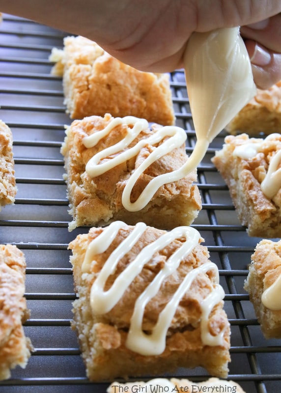 Nutty Eggnog Bars - Super chewy bars with macadamia nuts that are drizzled with an eggnog glaze. the-girl-who-ate-everything.com