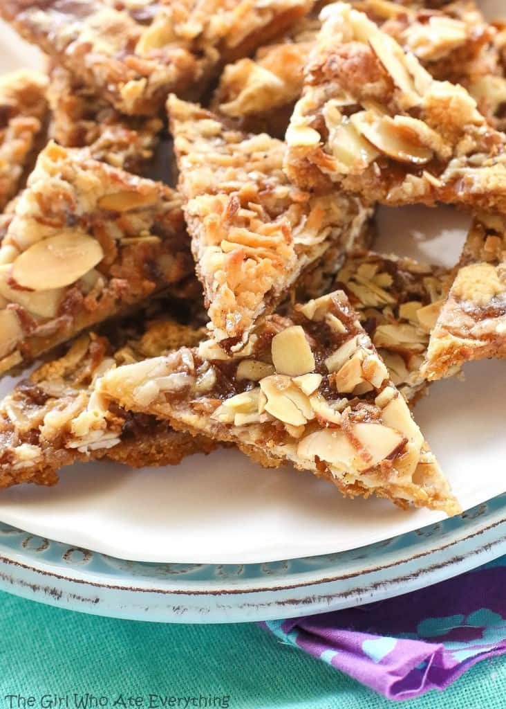 Caramel Heavenlies - layers of graham cracker, cinnamon, caramel, coconut, marshmallows, and almonds. the-girl-who-ate-everything.com