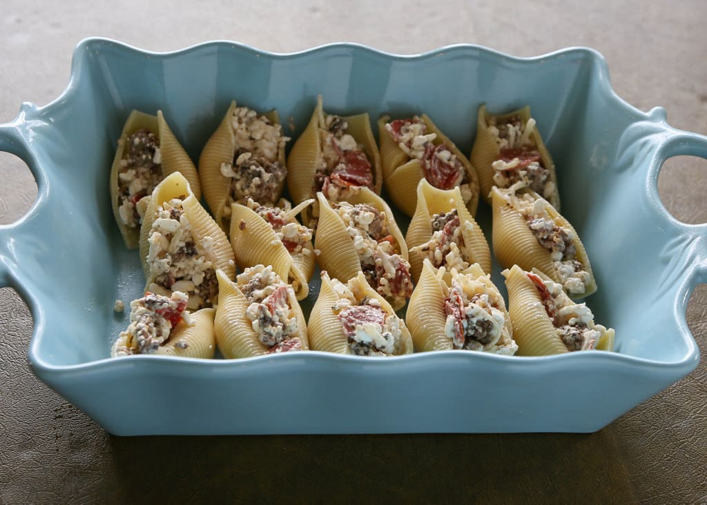 Pizza Stuffed Shells - pasta stuffed with sausage and pepperoni. Total crowd pleaser. the-girl-who-ate-everything.com