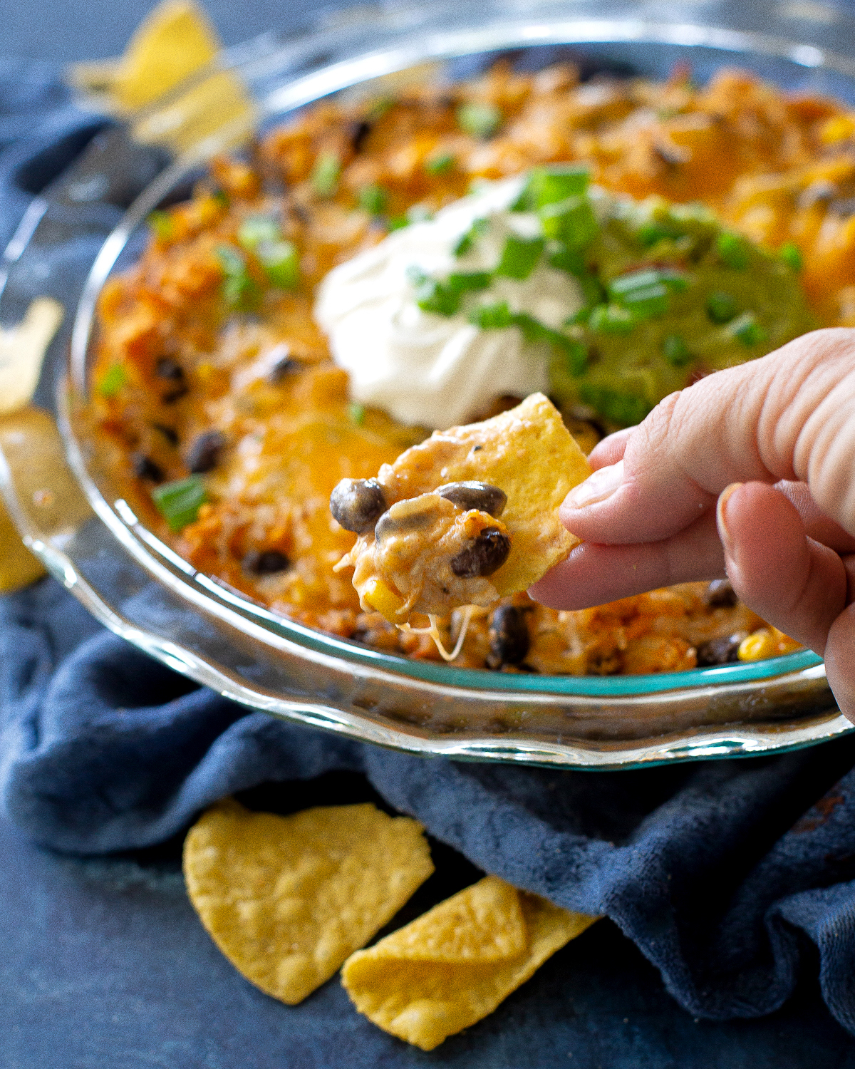 This Chicken Burrito Dip appetizer has all of the flavors of your favorite burrito but in dip form. The leftovers are great as a burrito filling! #burrito #dip #recipe