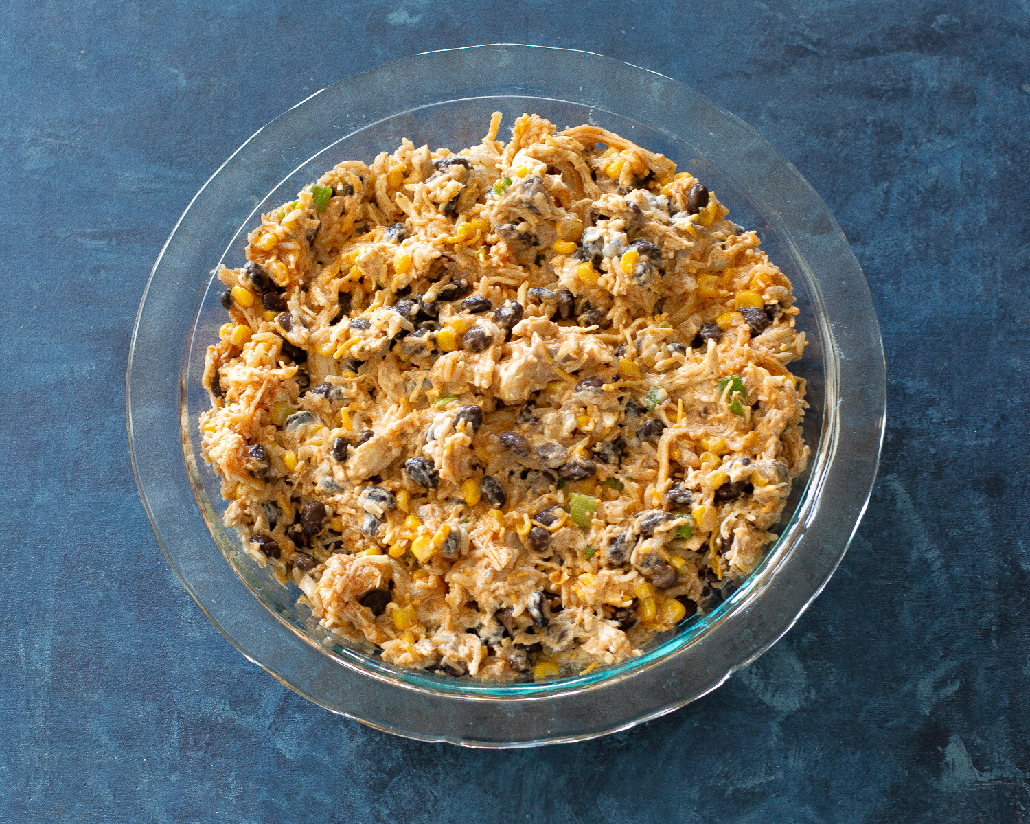 This Chicken Burrito Dip appetizer has all of the flavors of your favorite burrito but in dip form. The leftovers are great as a burrito filling! #burrito #dip #recipe