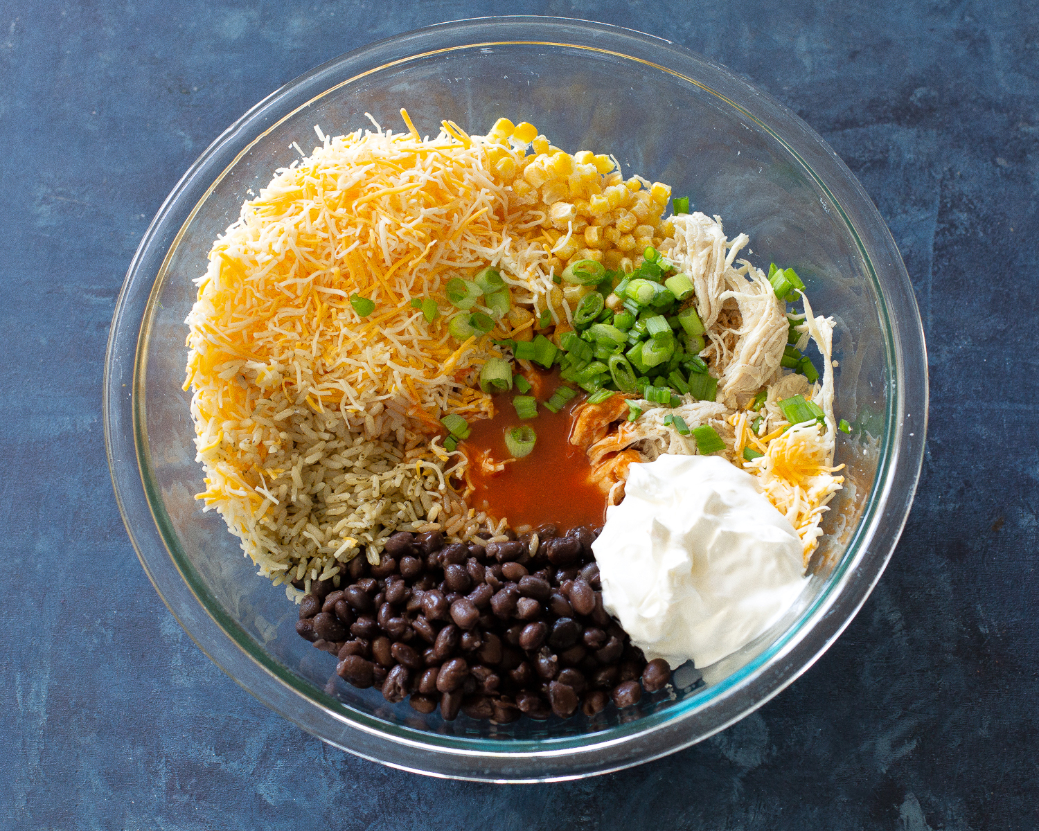This Chicken Burrito Dip appetizer has all of the flavors of your favorite burrito but in dip form. The leftovers are great as a burrito filling! #burrito #dip #recipe