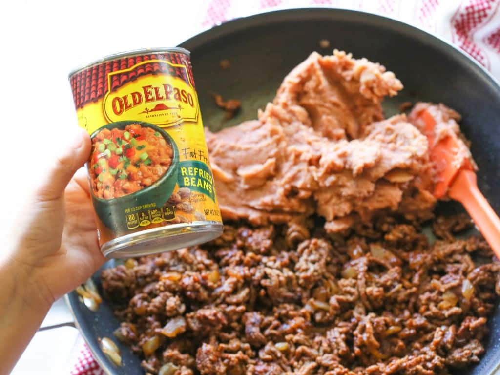 These Mini Burritos are filled with seasoned meat, beans, and cheese. Serve them as an appetizer and let your guests top their own. #burritos #mexican #appetizer