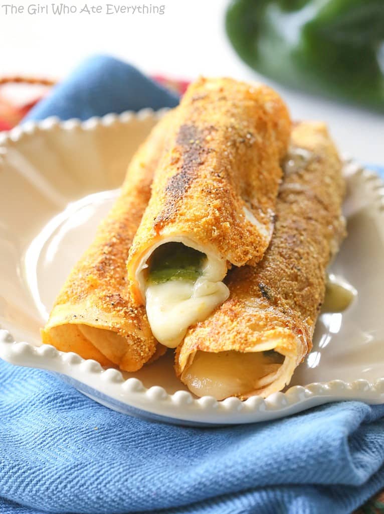 Chile Relleno Flautas - a poblano pepper and Monterey Jack cheese rolled up in a flour tortilla, sprinkled with seasoned cornmeal, and pan-fried until toasty. the-girl-who-ate-everything.com