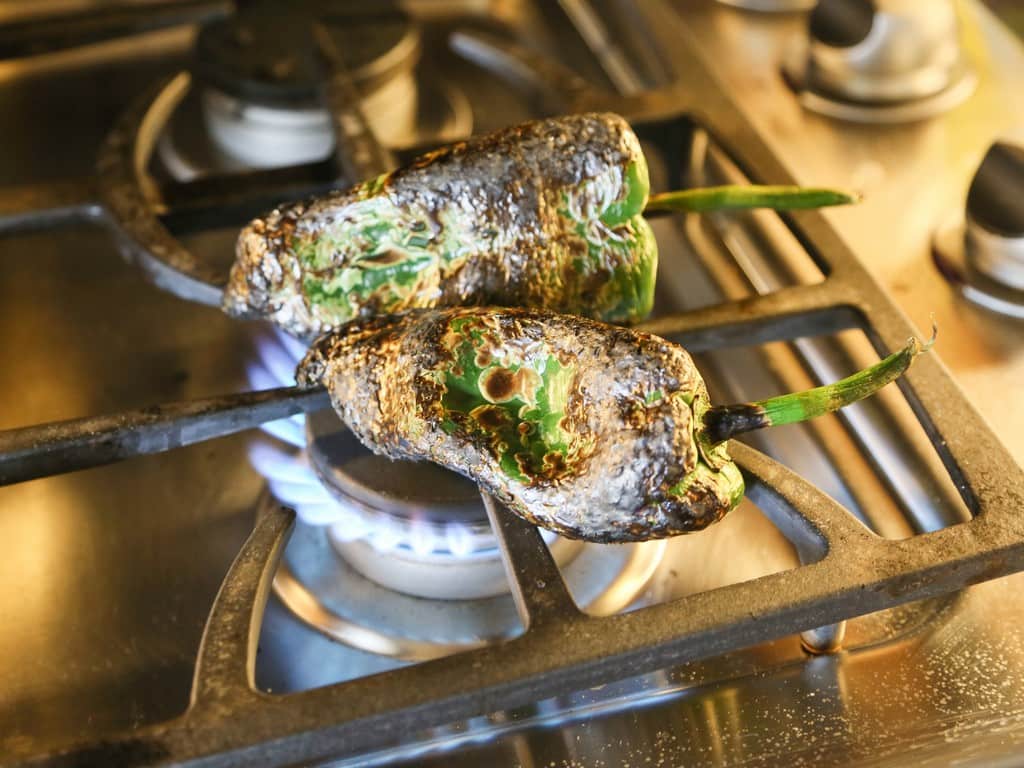 Chile Rellenos Flautas - a poblano pepper and Monterey Jack cheese rolled up in a flour tortilla, sprinkled with seasoned cornmeal, and pan-fried until toasty. the-girl-who-ate-everything.com