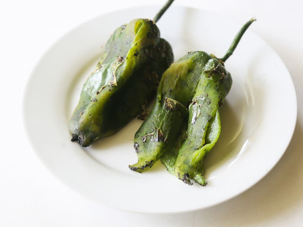 Chile Relleno Flautas - a poblano pepper and Monterey Jack cheese rolled up in a flour tortilla, sprinkled with seasoned cornmeal, and pan-fried until toasty. the-girl-who-ate-everything.com