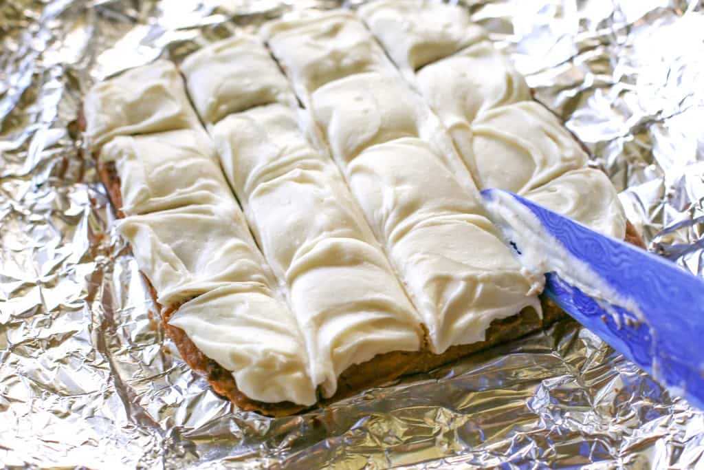 Cinnamon Roll Blondies - blondies with brown sugar and cinnamon swirled in and topped with cream cheese frosting. The yummy flavors of a cinnamon roll without the trouble of yeast. the-girl-who-ate-everything.com