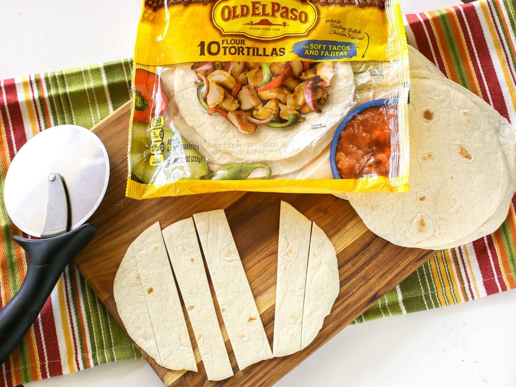 This Easy Beef Burrito Skillet has beef, black beans, salsa, and tortillas all cooked in one skillet. The tortillas turn soft and almost like a dumpling. This tasty dish is done in less than 20 minutes. the-girl-who-ate-everything.com