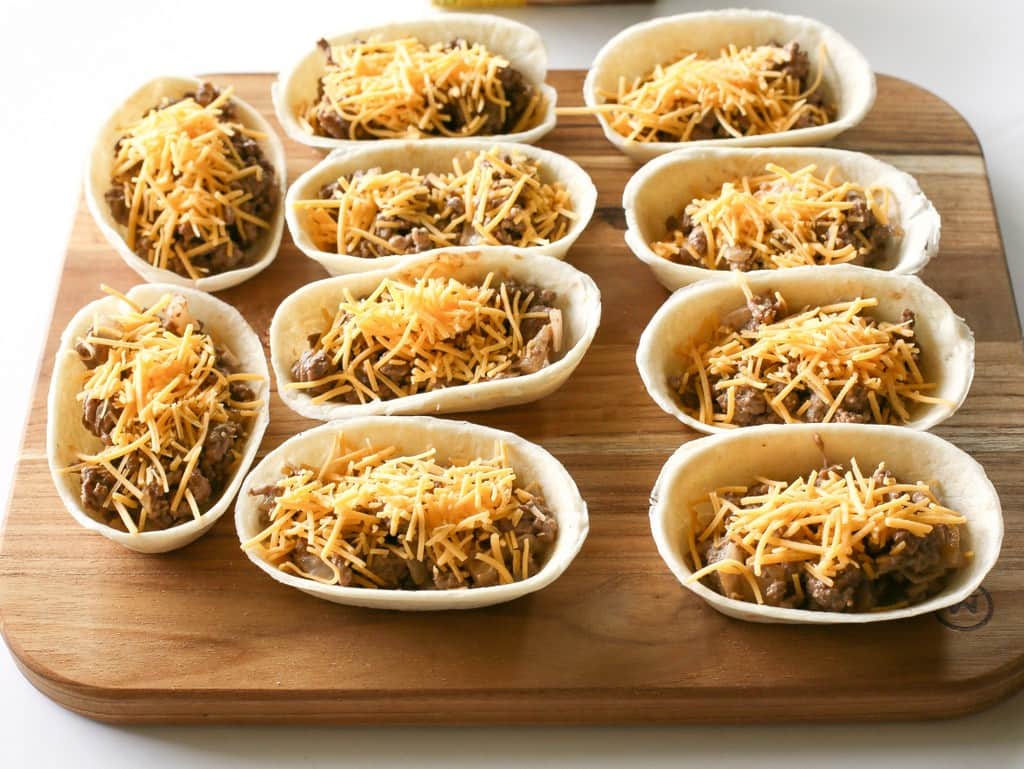 Bacon Cheeseburger Mini Boats - my family was skeptical but loved them! the-girl-who-ate-everything.com