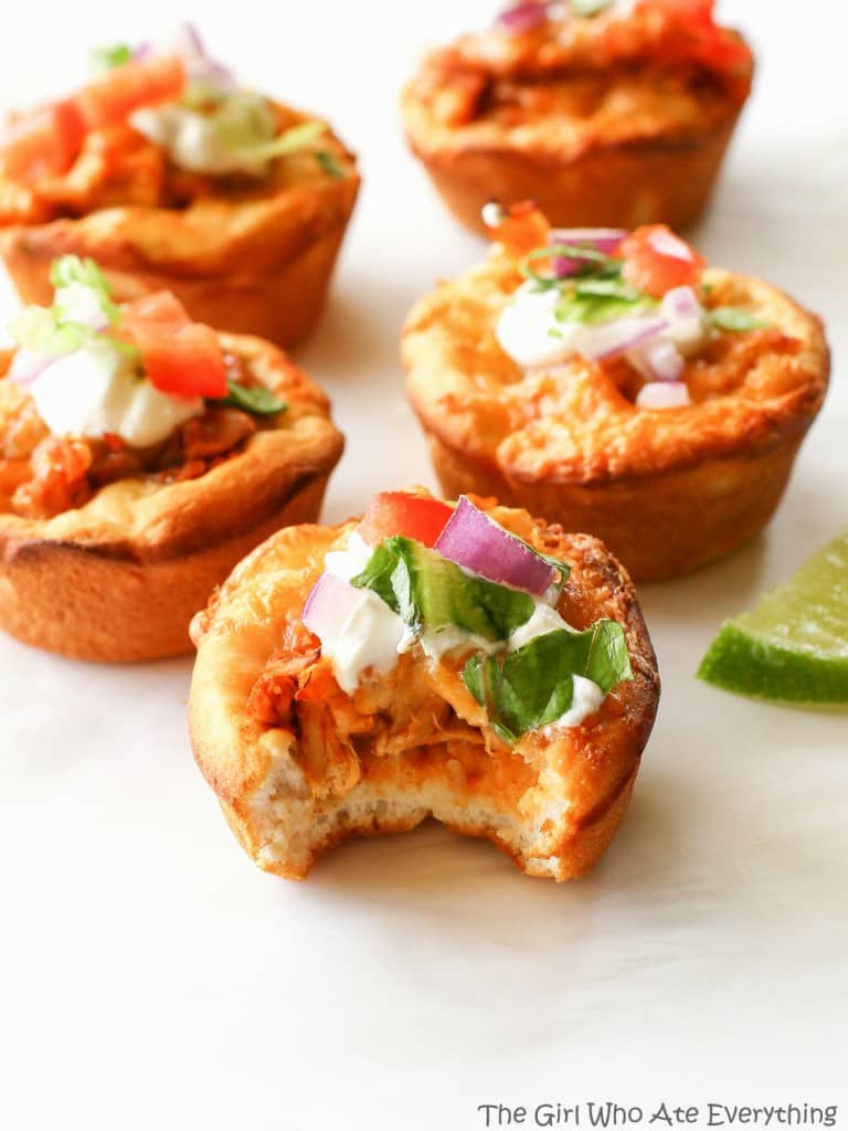Chicken Taco Cupcakes - biscuits filled with taco chicken, cheese, and all your taco fixings. the-girl-who-ate-everything.com