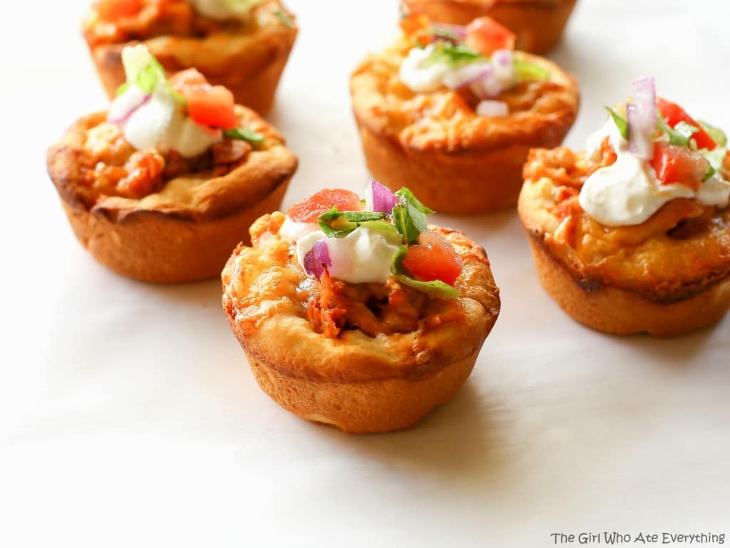 Chicken Taco Cupcakes - biscuits filled with taco chicken, cheese, and all your taco fixings. the-girl-who-ate-everything.com