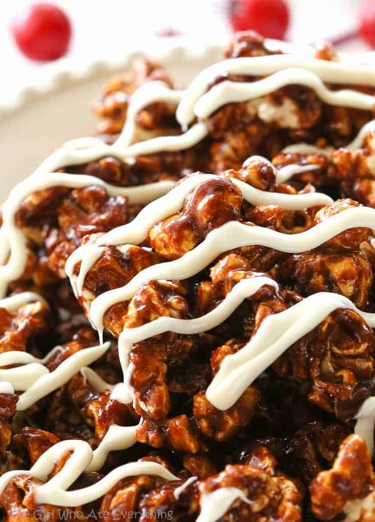 Gingerbread Caramel Popcorn - a crunchy popcorn with festive holiday flavors and drizzled with almond bark. A great neighbor gift for Christmas! the-girl-who-ate-everything.com