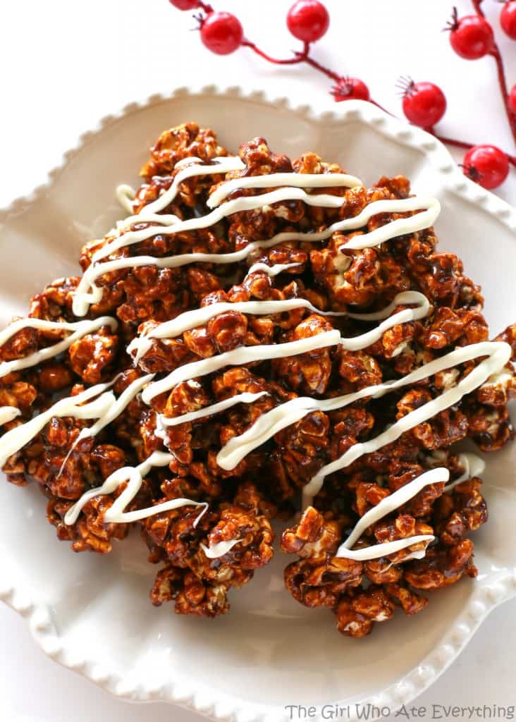 Gingerbread Caramel Popcorn - a crunchy popcorn with festive holiday flavors and drizzled with almond bark. A great neighbor gift for Christmas! the-girl-who-ate-everything.com