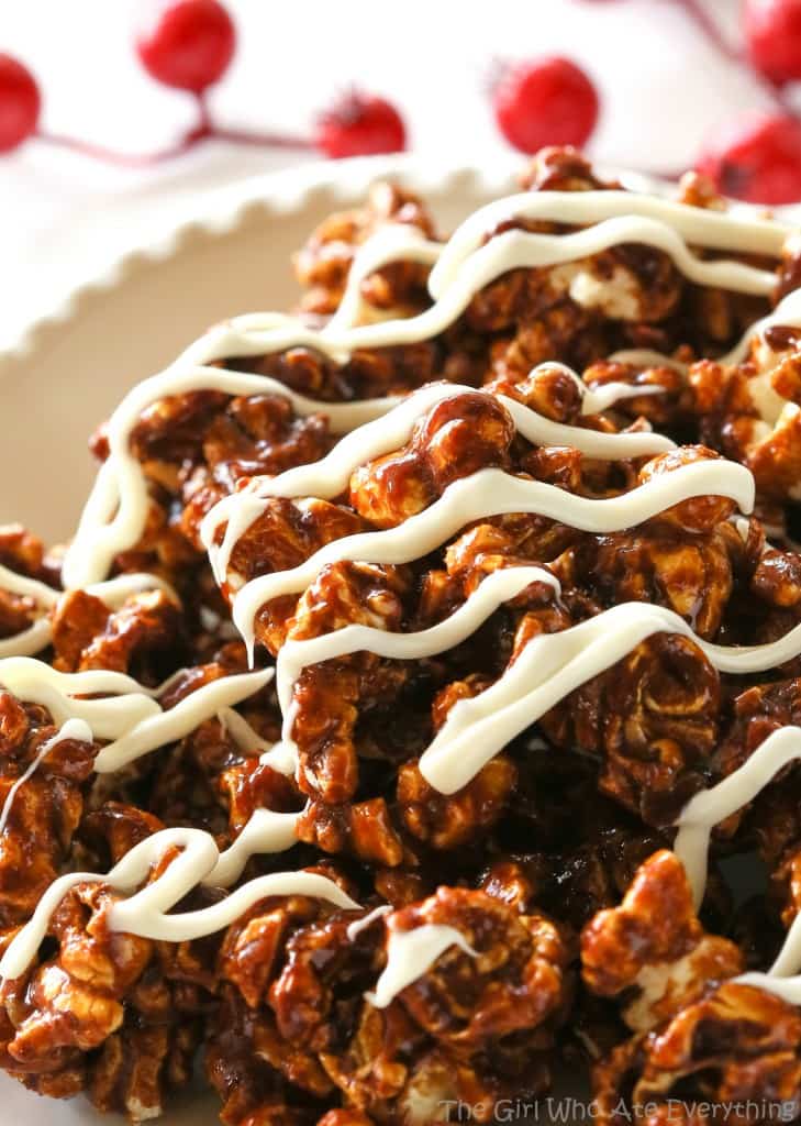 Gingerbread Caramel Popcorn - a crunchy popcorn with festive holiday flavors and drizzled with almond bark. A great neighbor gift for Christmas! the-girl-who-ate-everything.com
