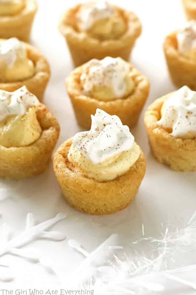 These Eggnog Cookie Cups are sugar cookie cups filled with a creamy eggnog filling. Super easy and festive for Christmas! the-girl-who-ate-everything.com