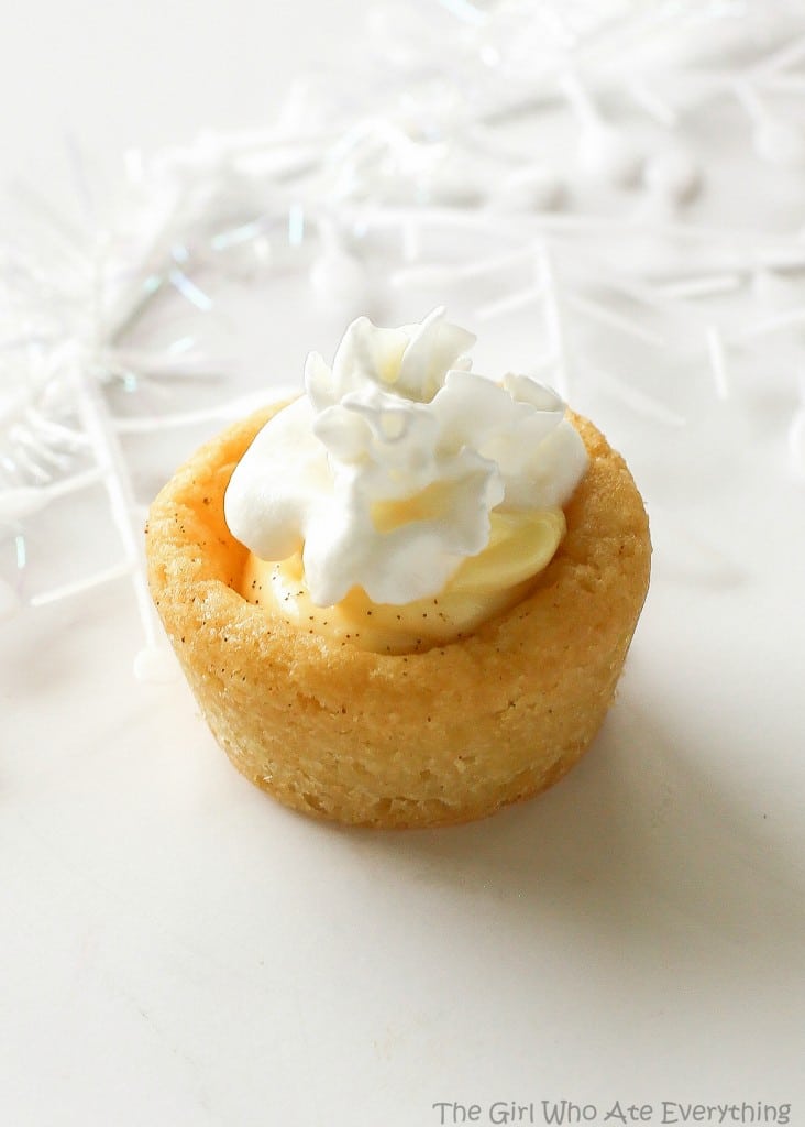These Eggnog Cookie Cups are sugar cookie cups filled with a creamy eggnog filling. Super easy and festive for Christmas! the-girl-who-ate-everything.com