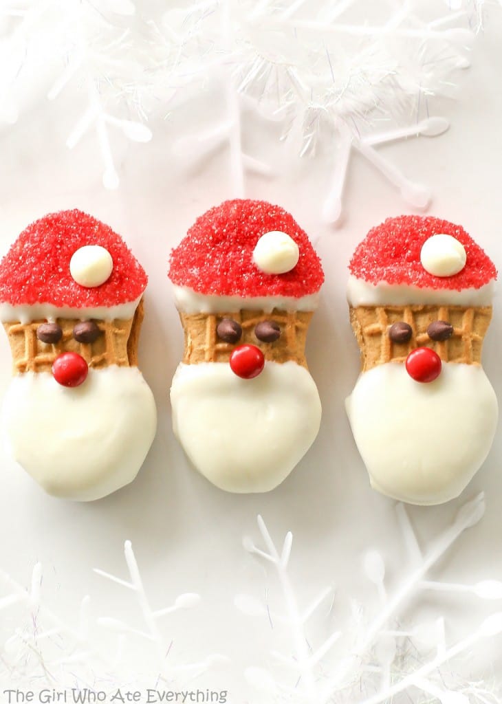 Santa Claus Cookies - easy Nutter Butter based cookies to make with your kids that are fancy enough to give to your friends. the-girl-who-ate-everything.com