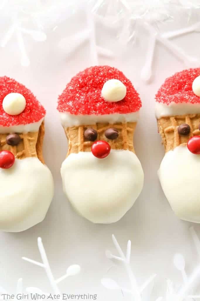Santa Claus Cookies - easy Nutter Butter based cookies to make with your kids that are fancy enough to give to your friends. the-girl-who-ate-everything.com