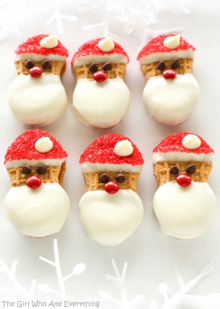 Santa Claus Cookies - easy Nutter Butter based cookies to make with your kids that are fancy enough to give to your friends. the-girl-who-ate-everything.com