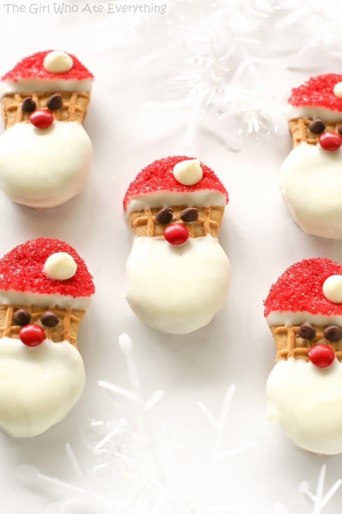 Santa Claus Cookies - easy Nutter Butter based cookies to make with your kids that are fancy enough to give to your friends. the-girl-who-ate-everything.com