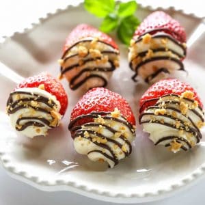 Mascarpone Stuffed Strawberrries. Sweet and silky mascarpone filled strawberries drizzled with chocolate and nuts. the-girl-who-ate-everything.com