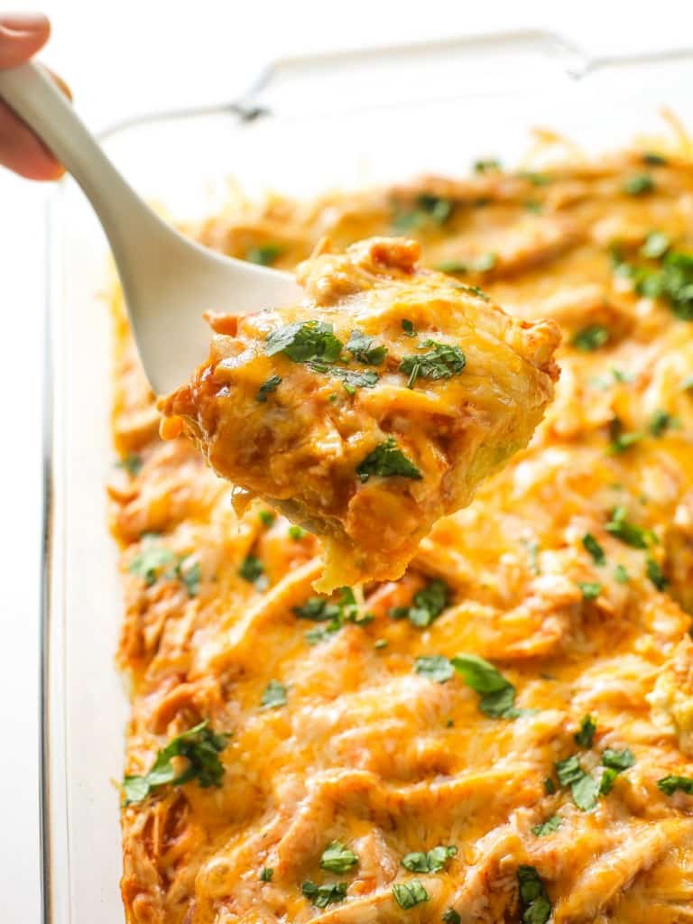 Chicken Tamale Casserole - a sweet cornbread crust topped with enchilada sauce and chicken. This is a crowd pleaser! the-girl-who-ate-everything.com